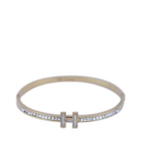 A hinged bangle bracelet with inset stones.