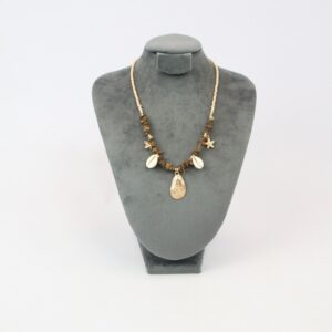 Beach style beaded necklace with mixed shells and starfish charms for casual summer wear.