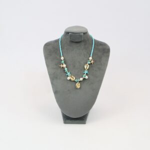 Beach style beaded necklace with mixed shells and starfish charms for casual summer wear.