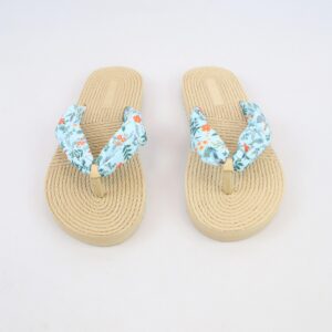 Flat sandals with rope-textured sole and fabric bow strap detail.