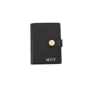 Compact card holder wallet with snap button closure and multiple card slots.