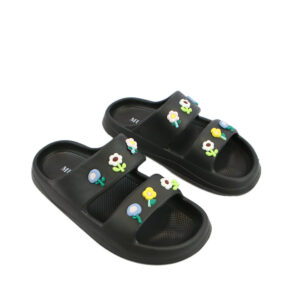 Beach slide sandals with floral charm detail and wide comfort strap for casual summer wear.