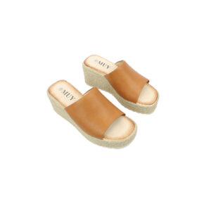 Wide strap wedge slide sandals with open toe design.