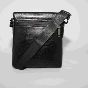 Textured crossbody bag with flap closure and logo detail.