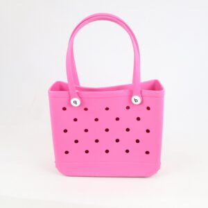 Beach tote bag with perforated design and structured base for easy carry.