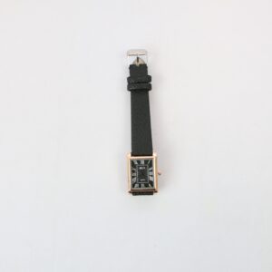 Classic rectangular wrist watch with Roman numeral dial and textured strap for everyday wear.