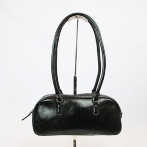 Structured shoulder bag with double handles and top zip closure for everyday use.