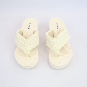 Knotted strap detail with a soft textured flat footbed sandal