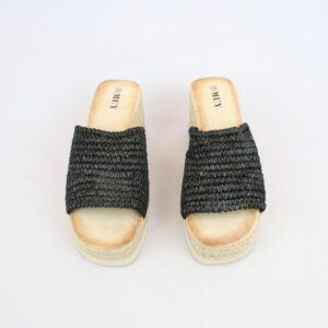 Woven strap wedge sandals with open toe design and textured upper.