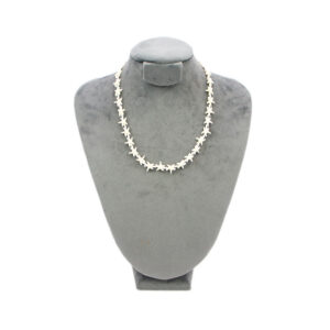 Adjustable sea design necklace with shell and bead details.