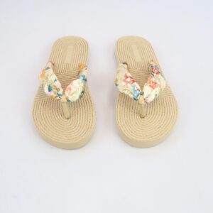 Flat sandals with rope-textured sole and fabric bow strap detail.