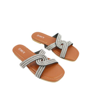 Flat sandals with crossover strap design and rhinestone detailing.