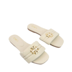 Padded strap with metal detail and a comfy flat footbed sandal