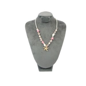 Beach style beaded necklace with mixed shells and starfish charms for casual summer wear.