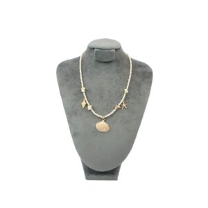 Beach style beaded necklace with mixed shells and starfish charms for casual summer wear.